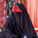 A woman at a market in Minab, in Iran’s southern Hormozgan province wears a “borke,” a facial cover for girls and women.